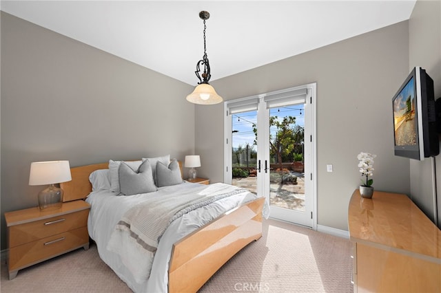 bedroom with light carpet, baseboards, and access to outside