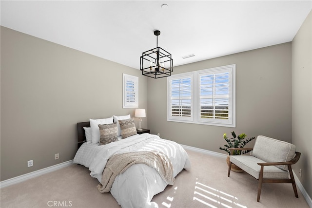 bedroom with baseboards, light carpet, and visible vents