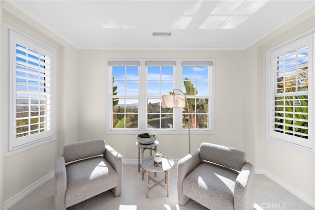 living area with visible vents and a healthy amount of sunlight