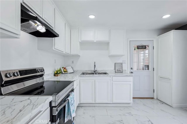 kitchen with white cabinets, stainless steel electric range oven, marble finish floor, under cabinet range hood, and a sink