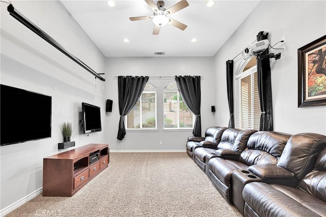 living area featuring carpet floors, baseboards, visible vents, and recessed lighting