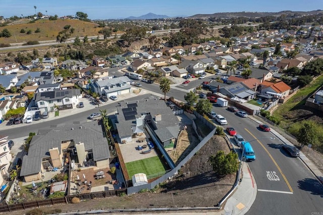 drone / aerial view featuring a residential view and a mountain view