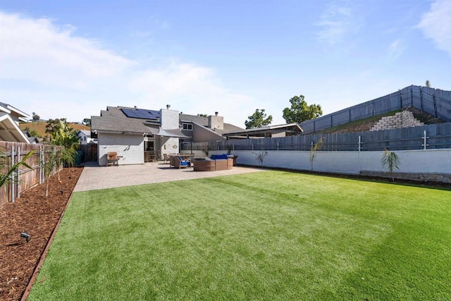 view of yard with a patio, outdoor lounge area, and a fenced backyard