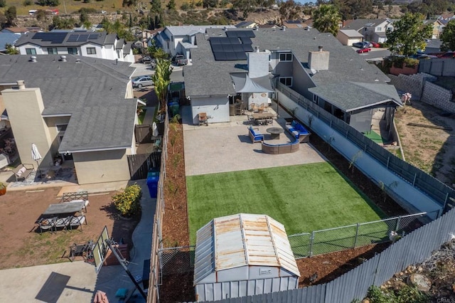 birds eye view of property with a residential view