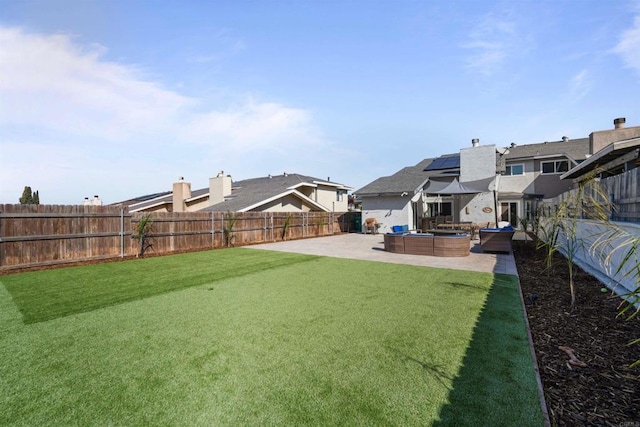 view of yard with a patio area, a fenced backyard, and an outdoor living space