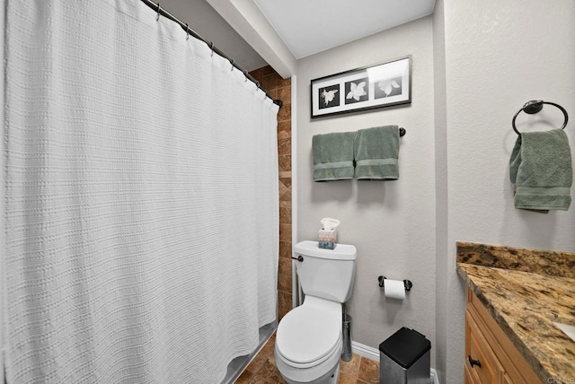 full bath featuring curtained shower, baseboards, vanity, and toilet