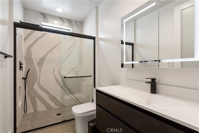 full bath featuring toilet, a marble finish shower, and vanity