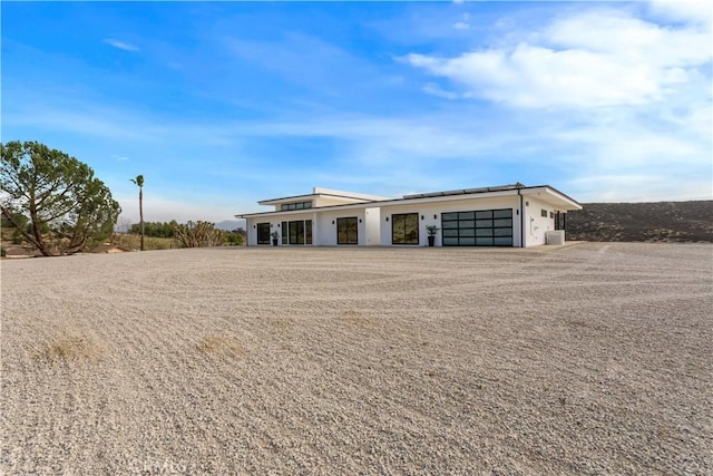 view of front of property with a garage and driveway