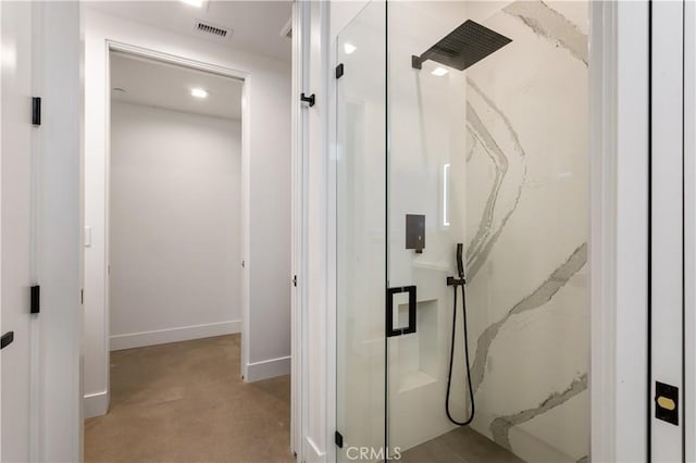 full bath with a marble finish shower, visible vents, and baseboards