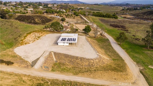 drone / aerial view featuring a mountain view