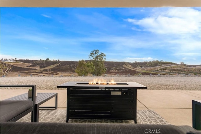 details featuring an outdoor fire pit and a mountain view