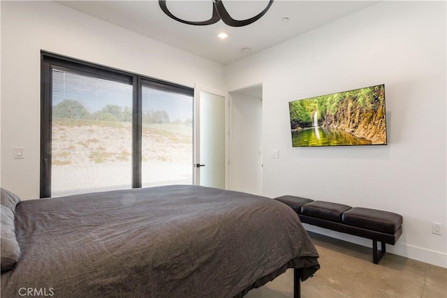 bedroom featuring access to exterior, recessed lighting, and baseboards