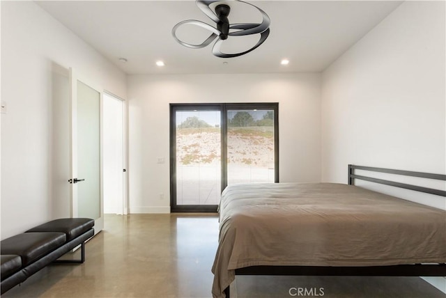 bedroom with finished concrete flooring, baseboards, and recessed lighting