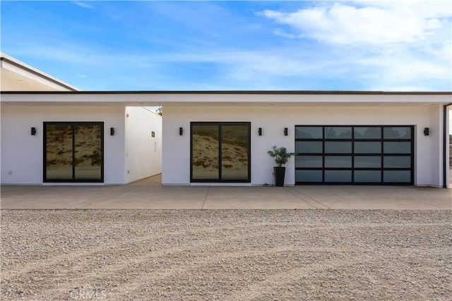 doorway to property with stucco siding