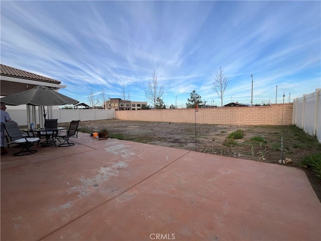 view of patio / terrace featuring outdoor dining space and a fenced backyard