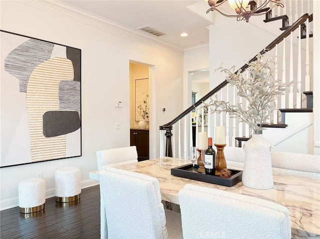 dining room with stairway, visible vents, ornamental molding, and baseboards