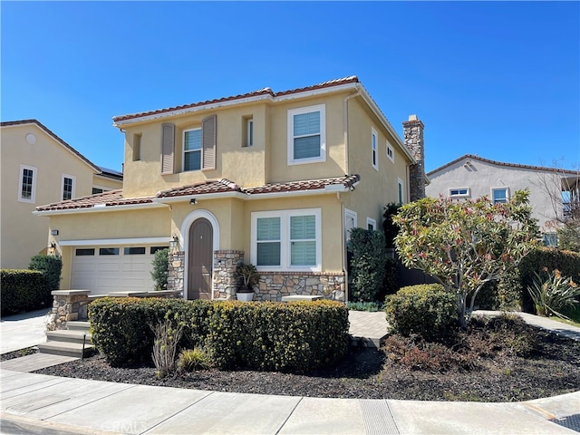 mediterranean / spanish-style home featuring stone siding, a tiled roof, and stucco siding