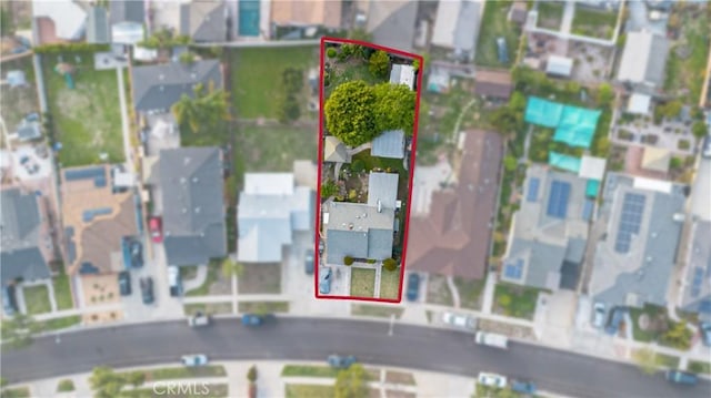 birds eye view of property with a residential view