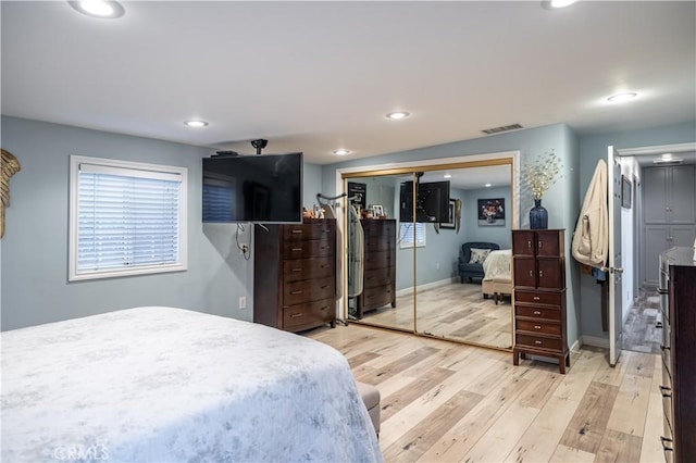 bedroom with light wood-type flooring, baseboards, visible vents, and recessed lighting