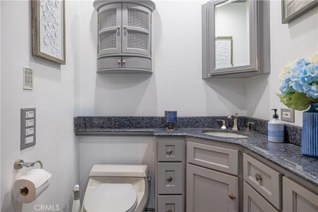 bathroom with vanity and toilet