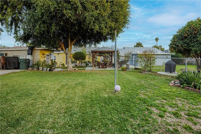 view of yard with a gazebo, a patio area, and fence