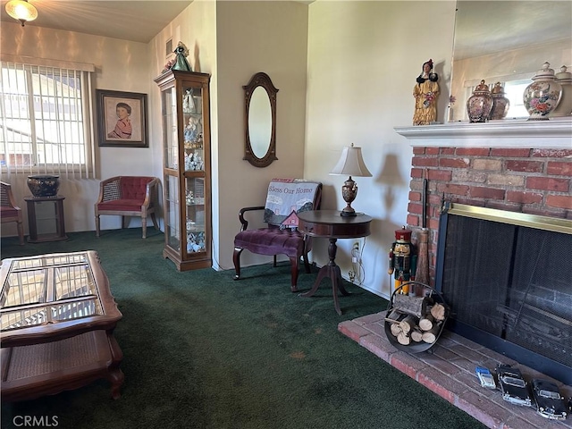 carpeted living area with a fireplace