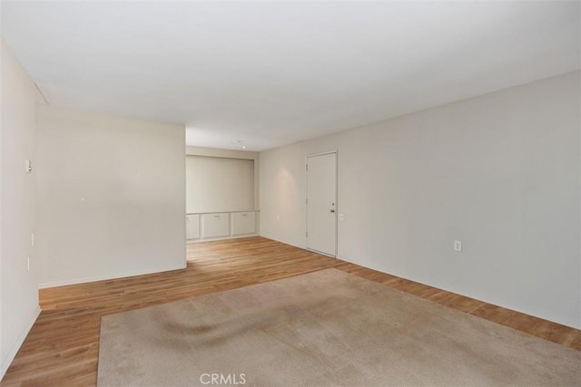 unfurnished room featuring light wood-style floors