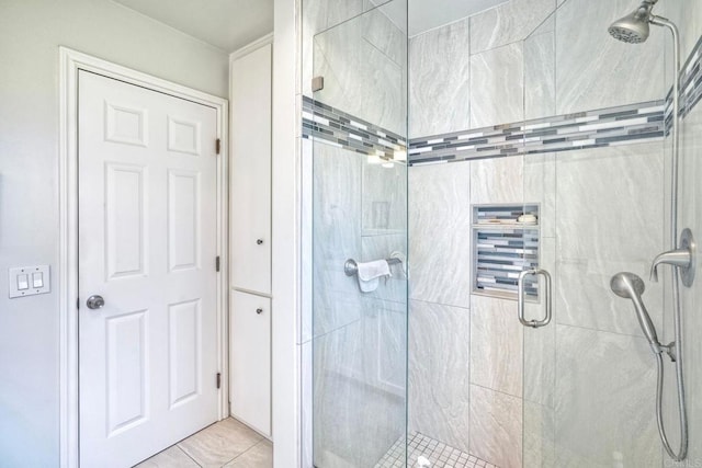 bathroom featuring a stall shower and tile patterned floors