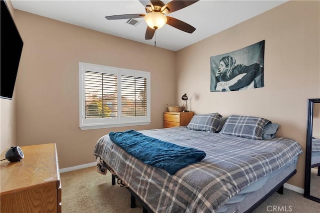 bedroom with a ceiling fan, visible vents, baseboards, and carpet flooring