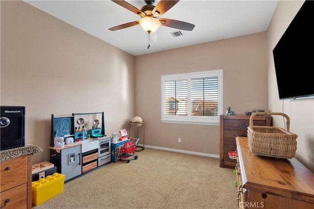 game room with carpet floors, visible vents, baseboards, and a ceiling fan