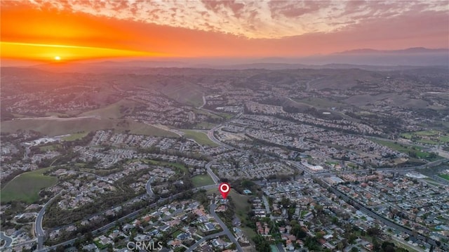 birds eye view of property featuring a mountain view