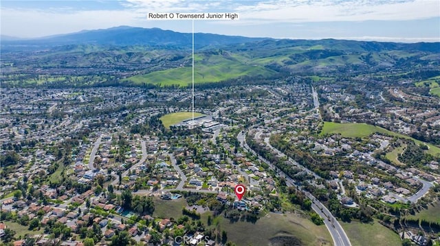 drone / aerial view featuring a mountain view