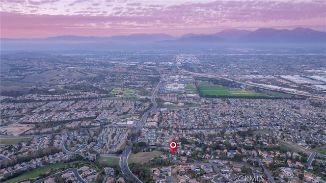 aerial view at dusk with a mountain view