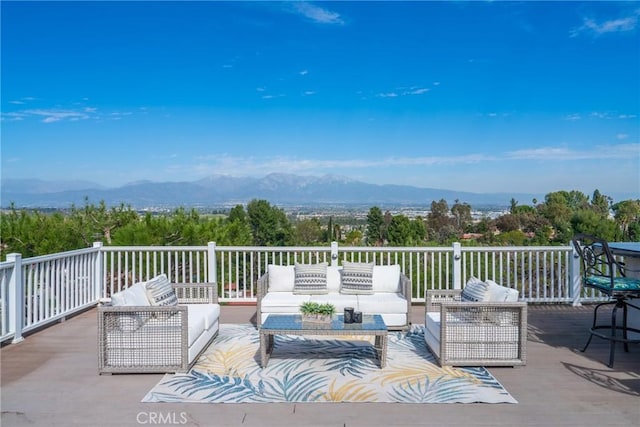 view of patio / terrace with a mountain view and an outdoor hangout area