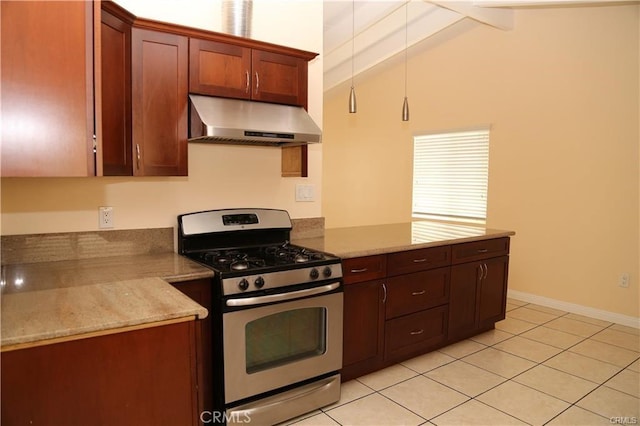 kitchen featuring lofted ceiling with beams, stainless steel gas range oven, light stone counters, and under cabinet range hood