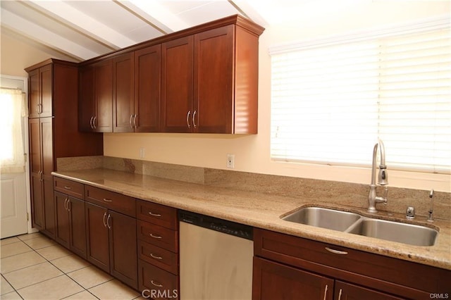 kitchen with a healthy amount of sunlight, a sink, dishwasher, and light tile patterned floors