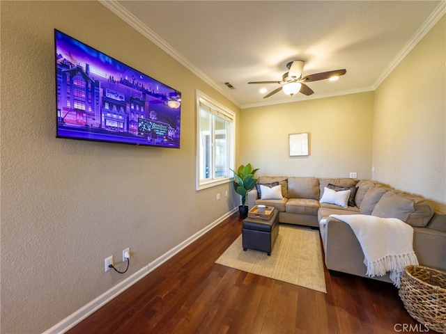 living room featuring visible vents, crown molding, baseboards, and wood finished floors