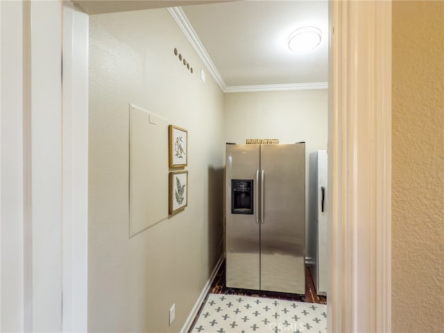 kitchen featuring baseboards, ornamental molding, and stainless steel fridge with ice dispenser