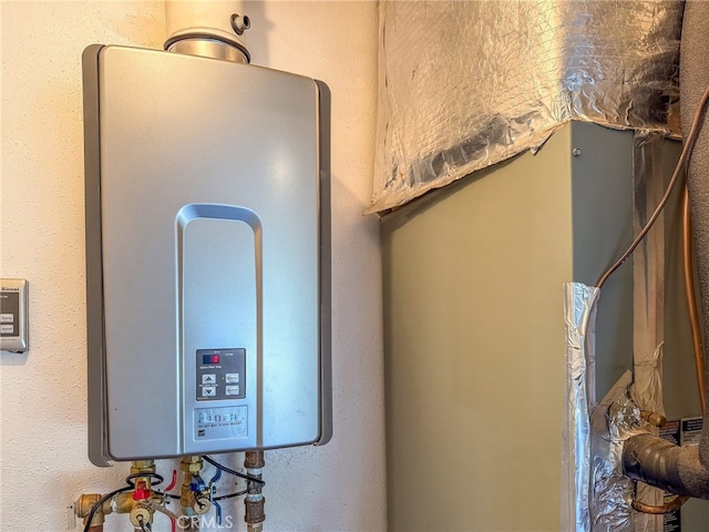 utility room with tankless water heater