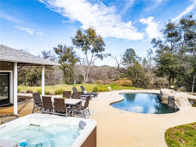 pool featuring a patio area, a hot tub, a grill, and outdoor dining space