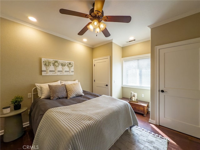 bedroom featuring dark wood-type flooring, recessed lighting, visible vents, and crown molding