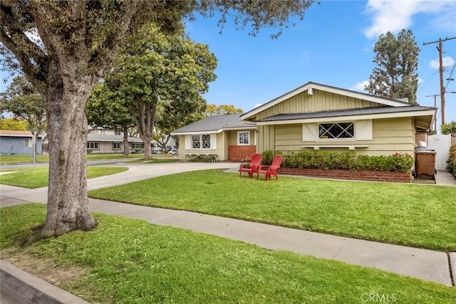 ranch-style home featuring a front yard and driveway