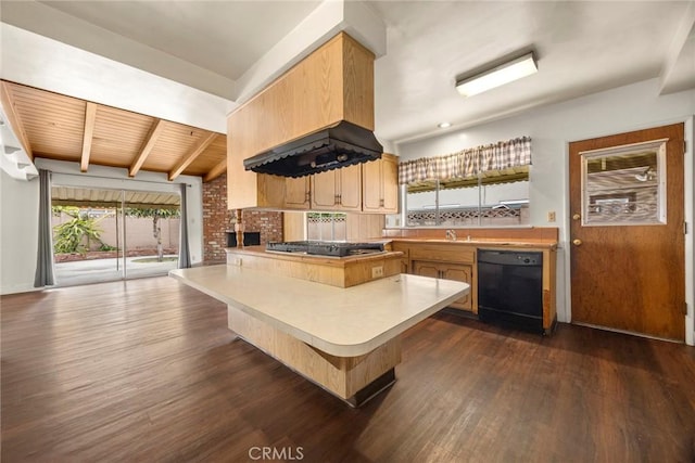 kitchen featuring black dishwasher, dark wood finished floors, a peninsula, light countertops, and gas cooktop