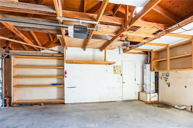 garage with gas water heater and a garage door opener