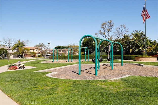 community jungle gym with a yard