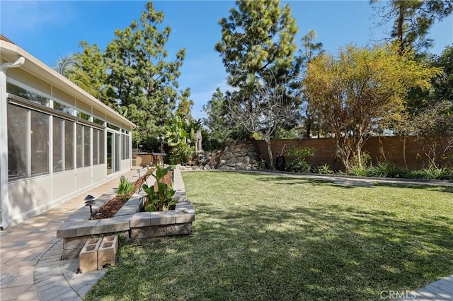 view of yard with a fenced backyard