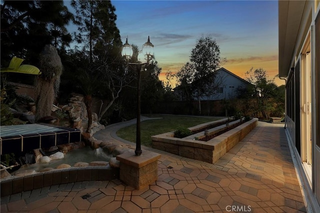 view of patio featuring fence