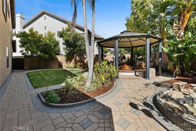 view of patio / terrace featuring a gazebo and a fenced backyard