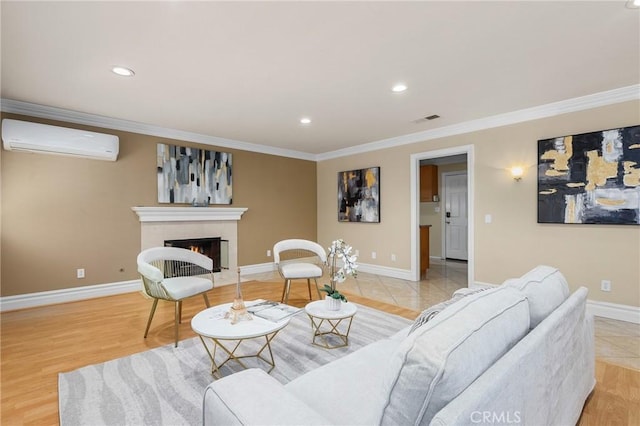 living area with crown molding, an AC wall unit, visible vents, and a fireplace