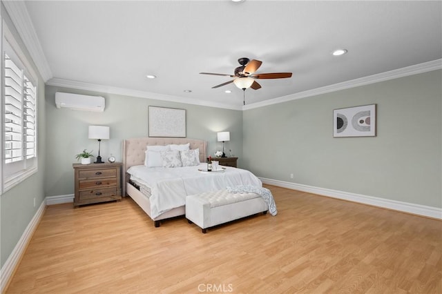 bedroom featuring light wood-type flooring, ornamental molding, a wall unit AC, and baseboards